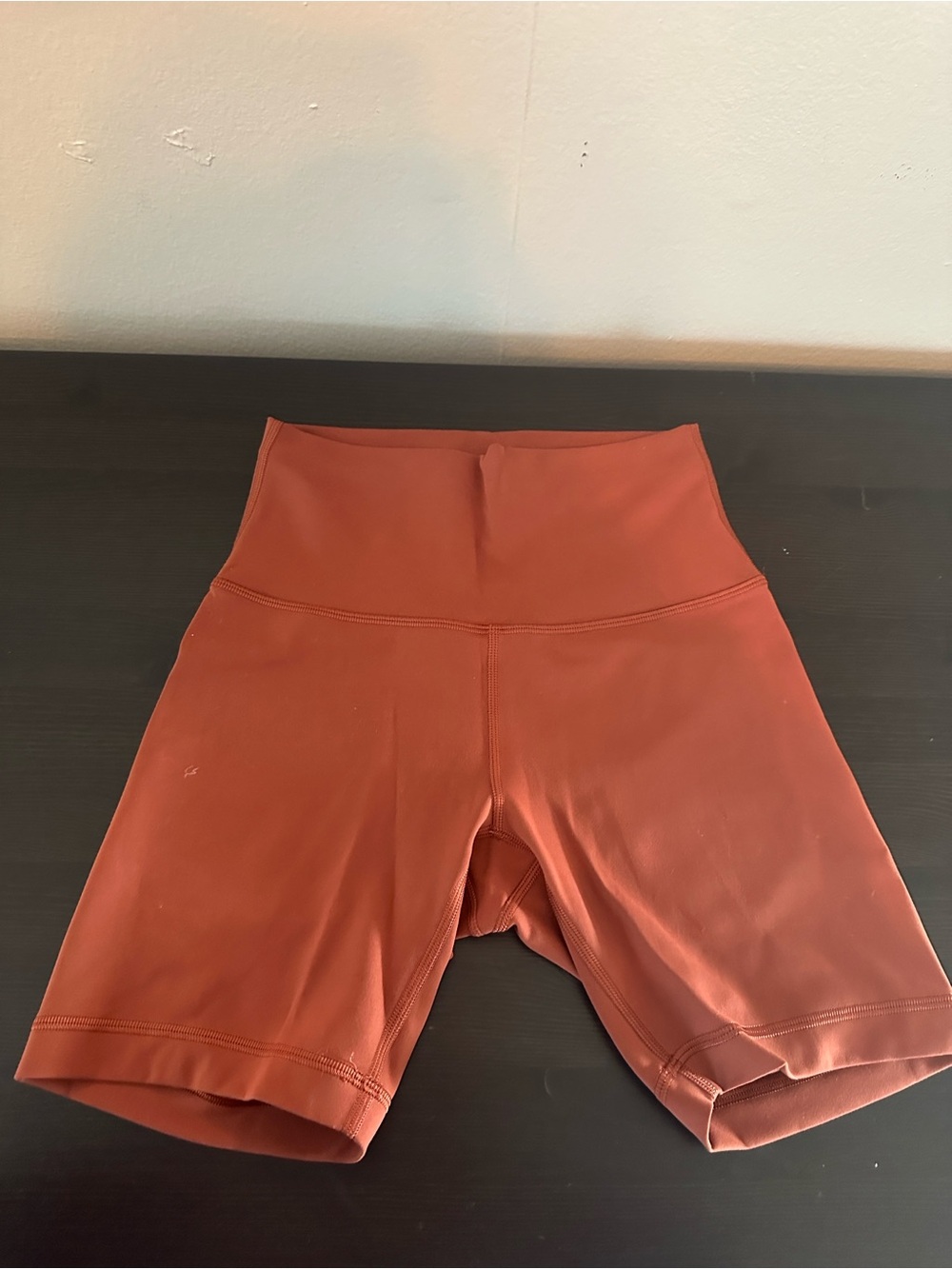 Wunder Train High-Rise Bike Shorts in Rust Orange